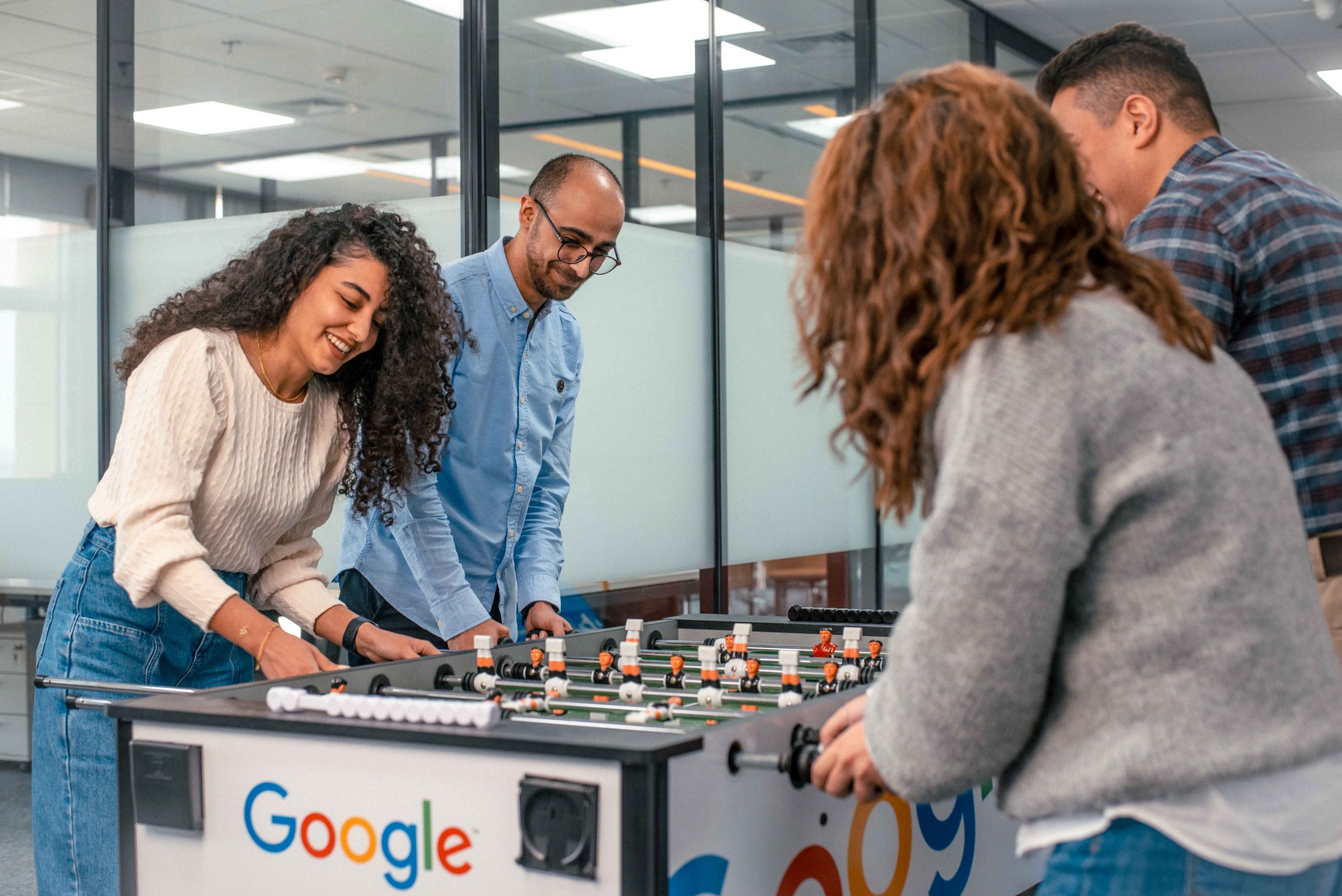 Colleagues playing Table Football